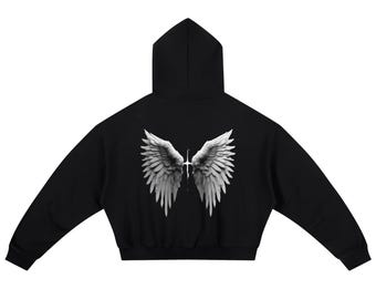 May include: Black hoodie with a hood and long sleeves. The back of the hoodie features a detailed white and gray graphic of angel wings with a cross in the center. The hoodie is a solid black color.