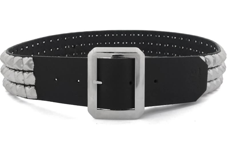 May include: A black leather belt with a silver buckle and three rows of silver pyramid studs.