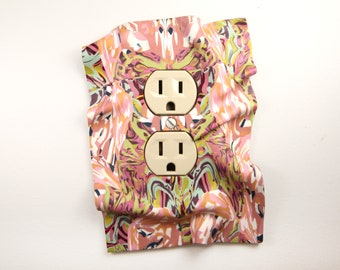 Electrical Outlet Cover, handmade, one-of-a-kind, pink, artistic, creative, windswept, playful, cute, 3-dimensional, eye-catching
