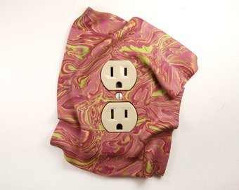 Electrical Outlet Cover, handmade, one-of-a-kind, pink, artistic, creative, eye-catching, cute, playful, windswept, 3-dimensional