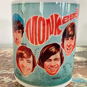 The MONKEES CERAMIC MUG 11oz 1960&#39;s Pop Band