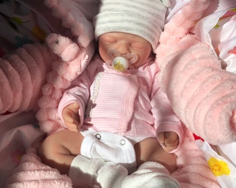Fully customize-able baby, 18-20 inches, full body silicone, weighted, and painted, and can take full pacifier