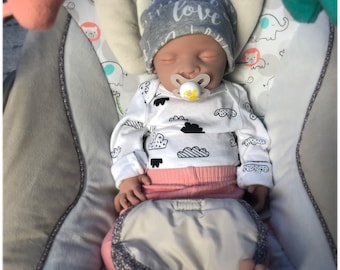Emery, 18 inches, full body silicone, painted, and weighted, can take a full pacifier