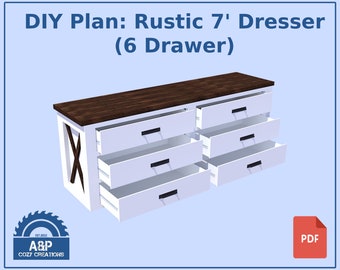 May include: DIY plan for building a rustic 7 foot long dresser with six drawers. The dresser is white with a dark brown wood top. The drawers are partially open, revealing the white interior. The plan is available as a PDF download.