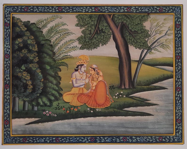 May include: A traditional Indian painting depicting a couple in a lush green landscape. The man is wearing a yellow robe and the woman is wearing a red and orange sari. They are sitting by a river under a large tree.