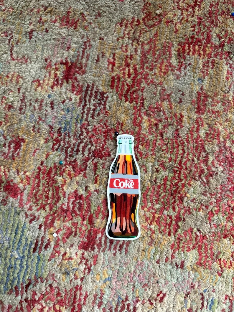 May include: A vintage-style Coca-Cola bottle illustration with a red and white label that says "Coke". The bottle is brown and has a white cap. The illustration is on a white background.