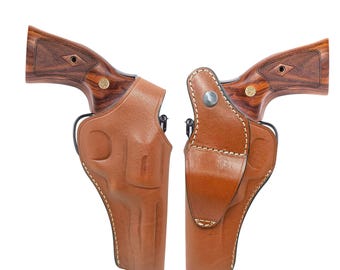 Coldre de couro: Série Heritage Rough Rider, com fecho de pressão para o polegar e duas posições de porte.