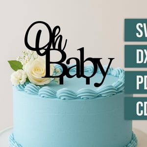 May include: A light blue frosted cake with a black "Oh Baby" cake topper and white flowers. The cake has a decorative border and is on a white cake stand. The image also includes SVG, DXF, PDF, and CDR text.