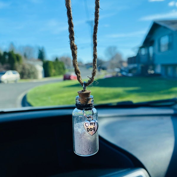 Mini Cork Bottle Dog or Cat Cremation Necklace Urns for your pets ashes. I have mine hanging from my rear view mirror in my car.