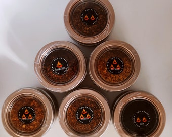 6 different types of hot chili peppers in magnetic spice tin boxes.