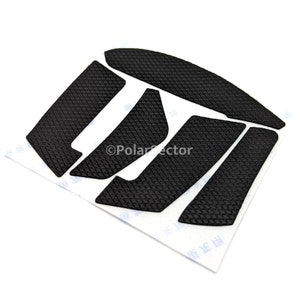 May include: A set of black textured mouse feet pads for gaming. The pads are designed to improve mouse glide and accuracy.