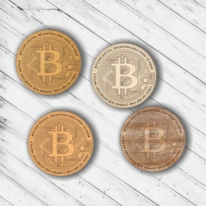 May include: Three wooden round coins with a laser-engraved design of a Bitcoin logo. The coins are inscribed with the text "BITCOIN DIGITAL DECENTRALIZED PEER TO PEER" and "TROY OZ 999 FINE COPPER MJB MONETARY METALS".