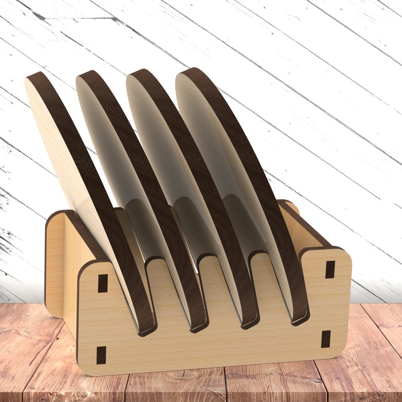 May include: Wooden coaster holder with four brown coasters. The holder is made of light brown wood and has a simple design.
