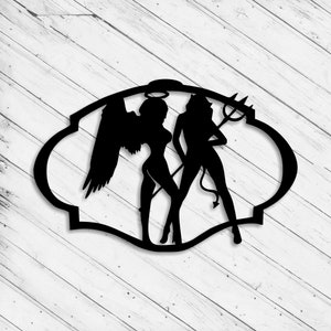 May include: Black silhouette of an angel and a devil, both female figures, with wings and horns, standing side by side within a decorative oval frame.