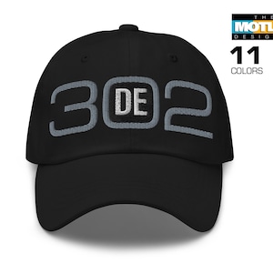 May include: A black baseball cap with a gray embroidered design that says "302".