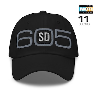 May include: Black baseball cap with a gray embroidered design that reads "605 SD".