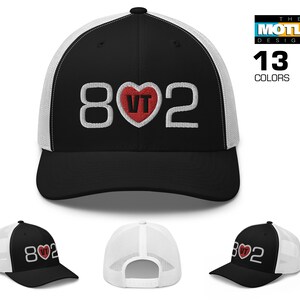 May include: Black and white trucker hat with a red heart that says "VT" inside. The numbers "802" are on either side of the heart.
