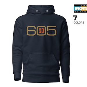 May include: A navy blue hooded sweatshirt with a gold and orange graphic that says "605 SD".