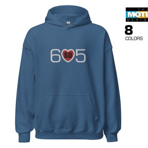 May include: A blue hooded sweatshirt with the text "605" in white with a red heart containing the letters "SD" in the center.