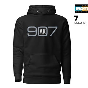 May include: Black hooded sweatshirt with a silver graphic that says "907 AK" on the front.