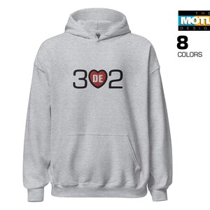 May include: A gray hooded sweatshirt with the text "3DE2" printed on the front. The "E" is a red heart.