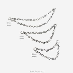 May include: Three silver-toned metal double-chain connectors with jump rings at each end. The chains are labelled with lengths of 40mm/50mm, 30mm/40mm, and 20mm/30mm. The text HYANGMI GU is printed at the bottom of the image.