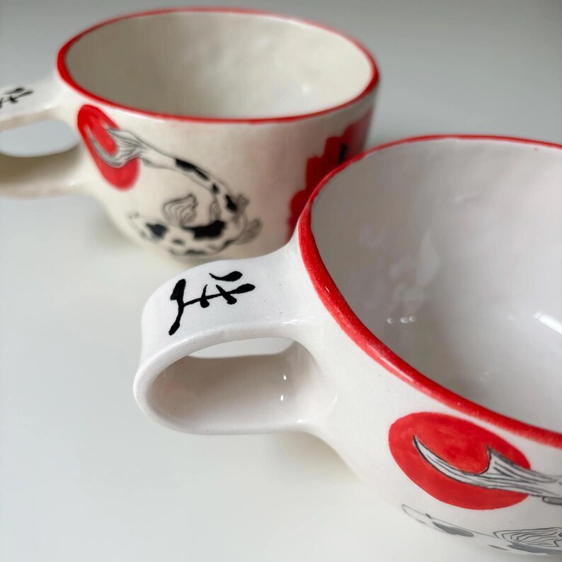 Koi Splash Travel Mug with a handle