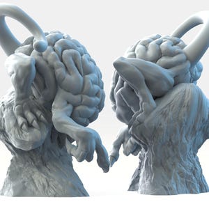 Op de afbeelding: Twee grijze, 3D-geprinte sculpturen van een brein met een mensachtig lichaam. De sculpturen staan ​​tegenover elkaar met hun armen uitgestrekt.