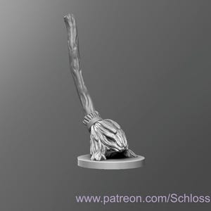 May include: A gray, detailed miniature of a witch's broom with a wooden handle and a bundle of twigs at the bottom.