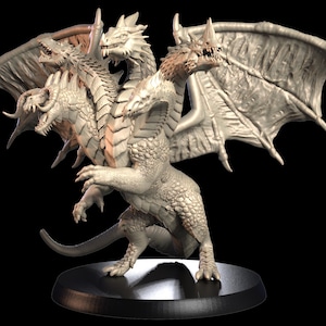 May include: A white, four-headed dragon figurine with wings outstretched. The dragon is standing on a black circular base.