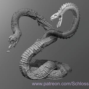 May include: A 3D printed model of a two-headed snake with a detailed, scaly texture. The snake is curled in a defensive position with its heads raised.