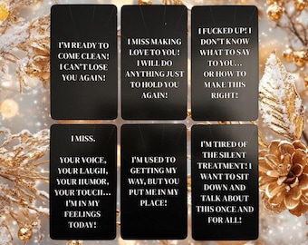 May include: Six black rectangular cards with white text. The cards have phrases like "I'm ready to come clean!" and "I miss making love to you!" The background has gold and white decorative elements.