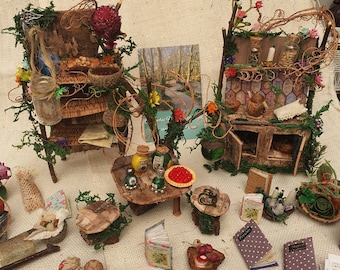 Fairy house kitchen - stove, table with stools and a set of shelves that are full of items.