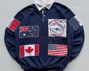 Polo de rugby azul marino con banderas de Australia de los años 90 (talla pequeña)