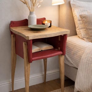 May include: A rustic wooden sign with the text "Welcome to our home" in white lettering. The sign features a distressed finish and a simple, inviting design, perfect for a front porch or entryway.