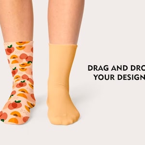 May include: A pair of socks, one with a peach pattern and the other plain yellow. The text "DRAG AND DROP YOUR DESIGN" is visible in the image.