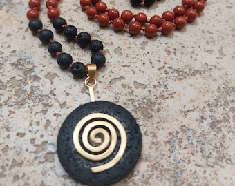 Mala necklace made of red jasper and lava beads with donut and gold spiral