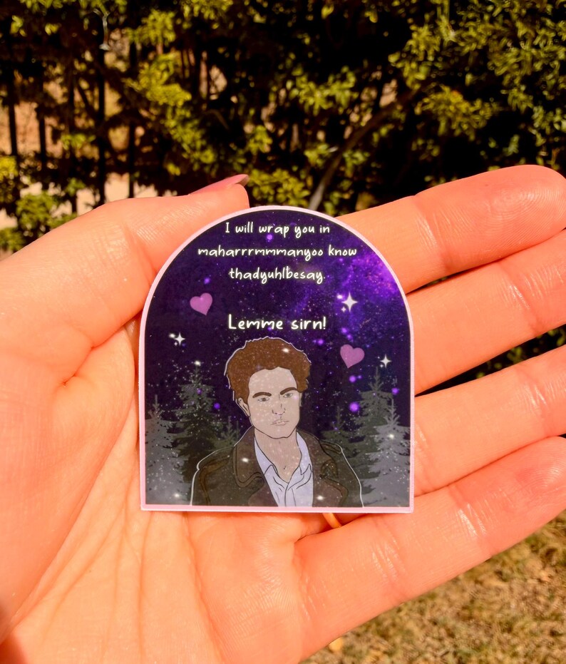 May include: A sticker with a purple and pink background featuring a male character illustration. The sticker has text that reads "I will wrap you in maharrrrmmmanoo know thadyuhlbesay. Lemme sirn!" with two purple hearts.