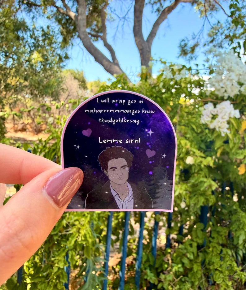 May include: A sticker with a purple and black background featuring a drawing of a man and text that reads "I will wrap you in maharrrrrmmanyoo know thadyuhlbessay. Lemme sirn!"