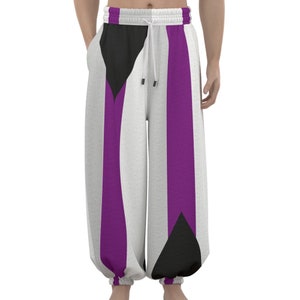 May include: White, purple, and black striped pants with a drawstring waist and elastic cuffs. The pants have a geometric pattern.