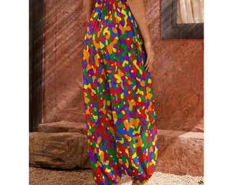 May include: Colorful, loose-fitting pants with a rainbow abstract print. The pants have an elastic waistband and a wide leg.