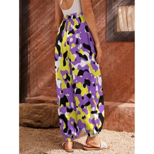 May include: Purple, yellow, and black patterned pants with a wide leg and elastic waistband.