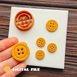 May include: A 3D printed orange plastic button mold with a circular frame and four internal pegs, alongside four finished yellow circular buttons with four holes each. The text "DIGITAL FILE" is printed in white at the bottom of the image.