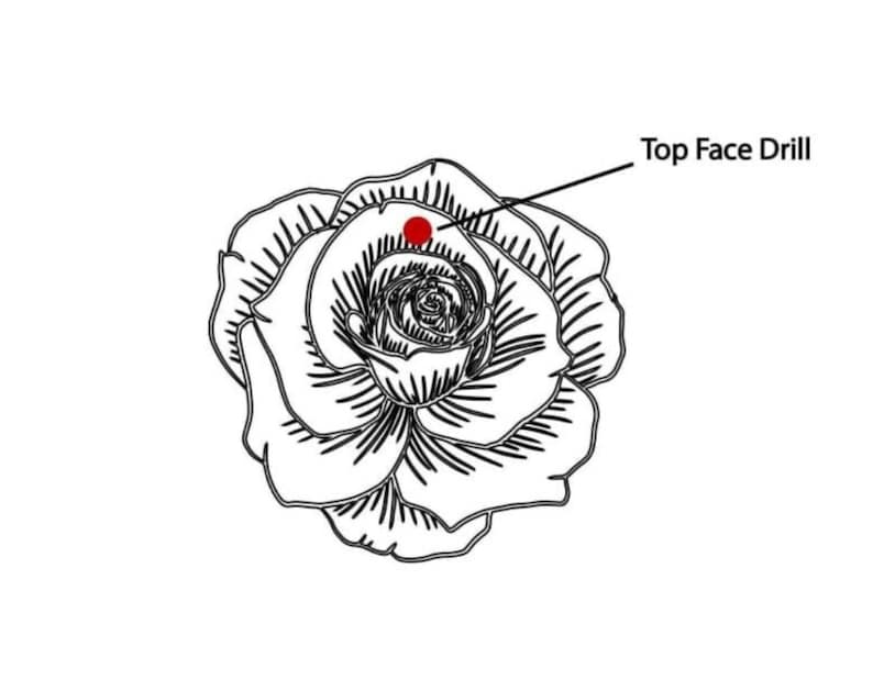 May include: Black and white line drawing of a rose with a red dot labeled "Top Face Drill". The rose is in full bloom, with detailed petals and a central spiral.
