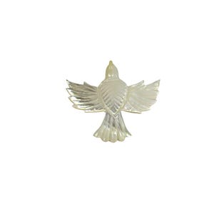 May include: A pearlescent, iridescent bird figurine with outstretched wings. The bird is depicted from a rear view, showcasing detailed feather patterns. The figurine is set against a plain white background, highlighting its form and design.