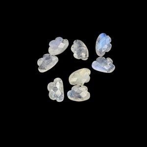 May include: A white ceramic mug with a black handle and the text "But First, Coffee" in a black, bold font. The mug is on a white surface. The mug is 10 cm tall.