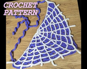 May include: Crochet pattern for a purple and white spiderweb design. The pattern is shown as a finished piece with a long purple cord.