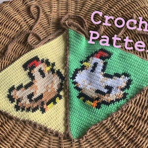 May include: Two crocheted chicken-shaped pennants, one yellow and one green, with brown trim. The pennants are hanging from a brown wicker basket. The text "Crochet Pattern" is written in pink letters above the pennants.