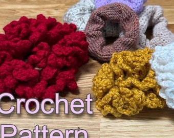 May include: A collection of handmade crochet scrunchies in various colors, including red, yellow, white, gray, purple, and brown. The text "Crochet Pattern" is displayed in a light purple font. The scrunchies are arranged on a wooden surface.