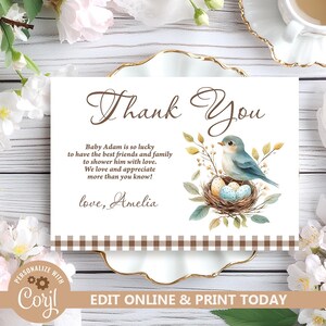 May include: Thank You card with a brown gingham border. The card features a watercolor illustration of a bluebird sitting in a nest with eggs. The text on the card reads "Thank You" in a brown script font. The text below the illustration reads "Baby Adam is so lucky to have the best friends and family to shower him with love. We love and appreciate more than you know! love, Amelia"